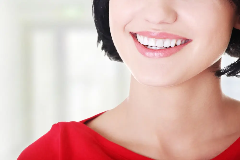 Woman with her perfect straight white teeth.